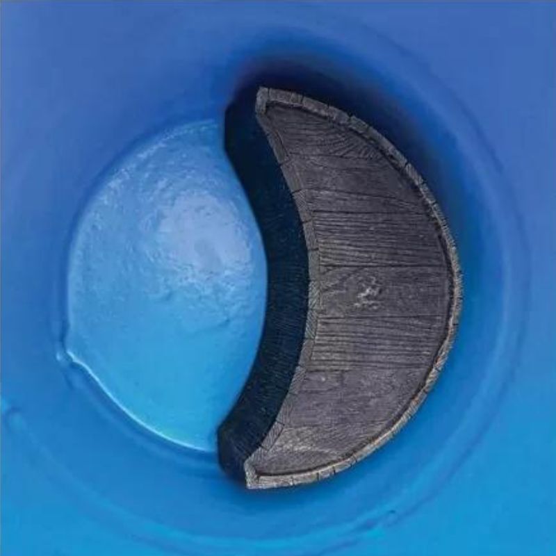 "Top view of The Ice Man's Barrel by Passion Ice Baths and Wim Hof, showing the interior of the barrel with a wooden, crescent-shaped seat submerged in water. The barrel's rustic wood finish contrasts with the blue interior."